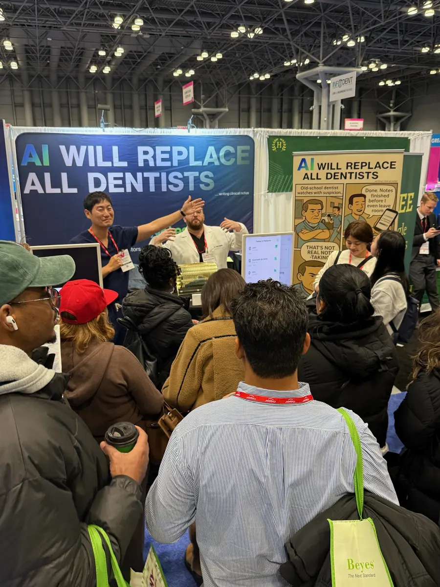 The CareNotes team demonstrating the app to a crowd at the GNYDM 2025 booth